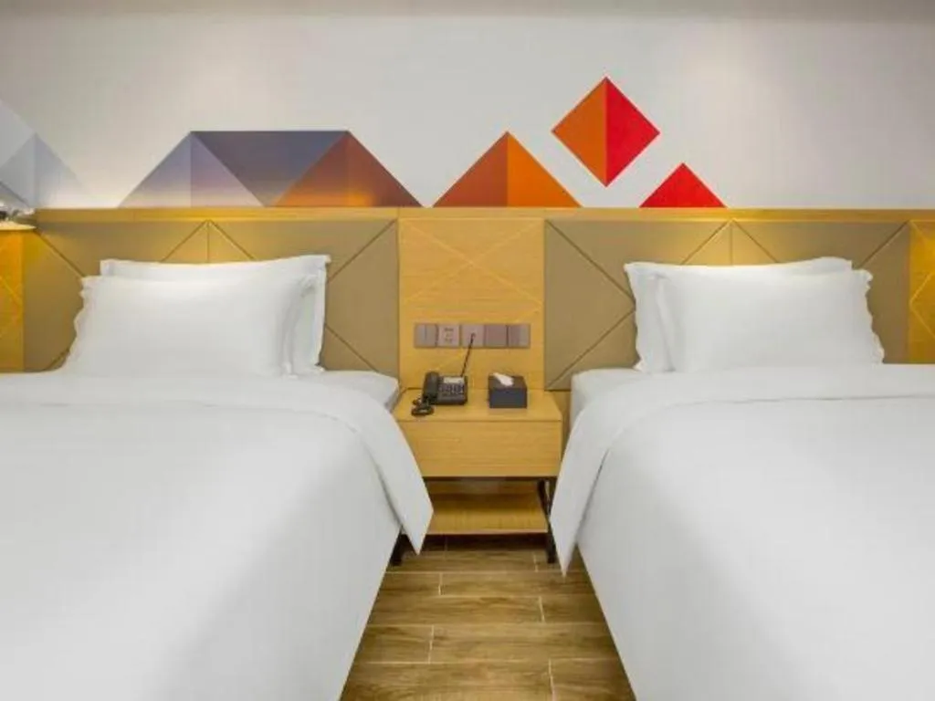 Bed in Borrman Hotel Zhuhai Gongbei Port Fuhuali Light Rail