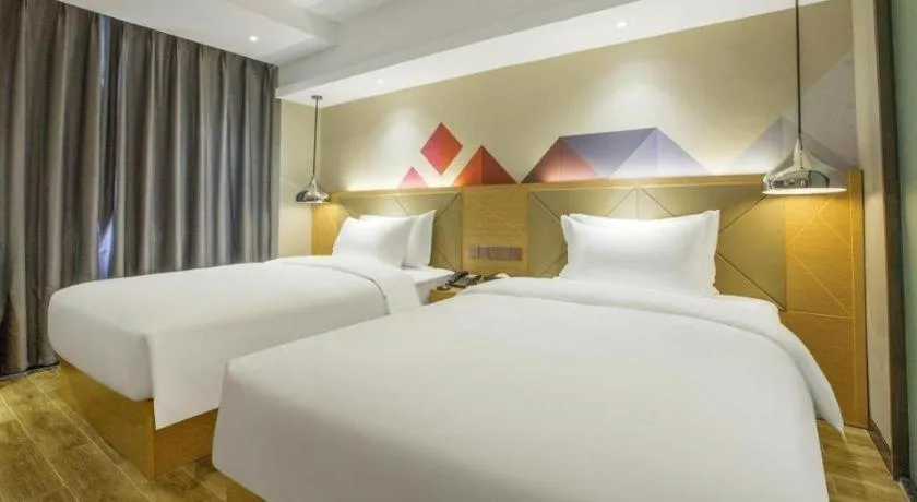Bed in Borrman Hotel Zhuhai Gongbei Port Fuhuali Light Rail