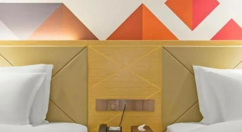 Bed in Borrman Hotel Zhuhai Gongbei Port Fuhuali Light Rail