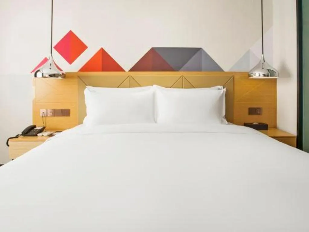 Bed in Borrman Hotel Zhuhai Gongbei Port Fuhuali Light Rail