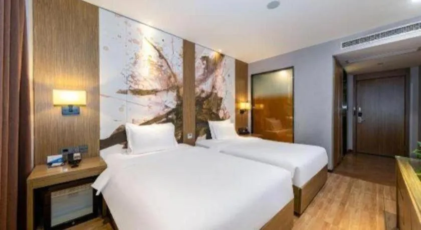 Bed in ZMAX Hotel Beijing Tongzhou Universal Tourist Resort Linheli Metro Station