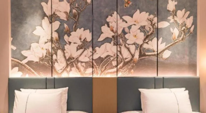 Bed in Magnotel Huludao Xingcheng Central Square Wenquan Street