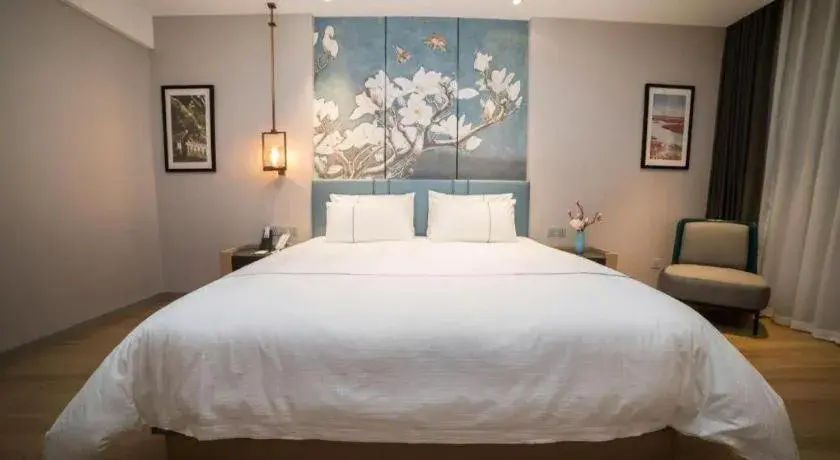 Bed in Magnotel Huludao Xingcheng Central Square Wenquan Street Bed in Magnotel Huludao Xingcheng Central Square Wenquan Street