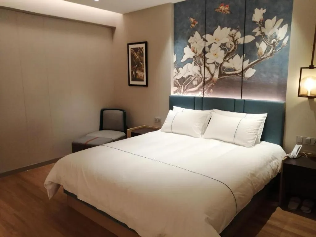 Bed in Magnotel Huludao Xingcheng Central Square Wenquan Street