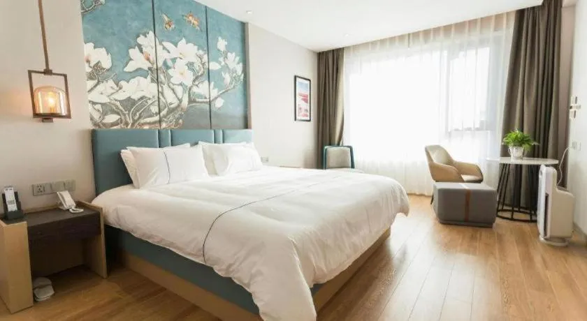 Bed in Magnotel Huludao Xingcheng Central Square Wenquan Street