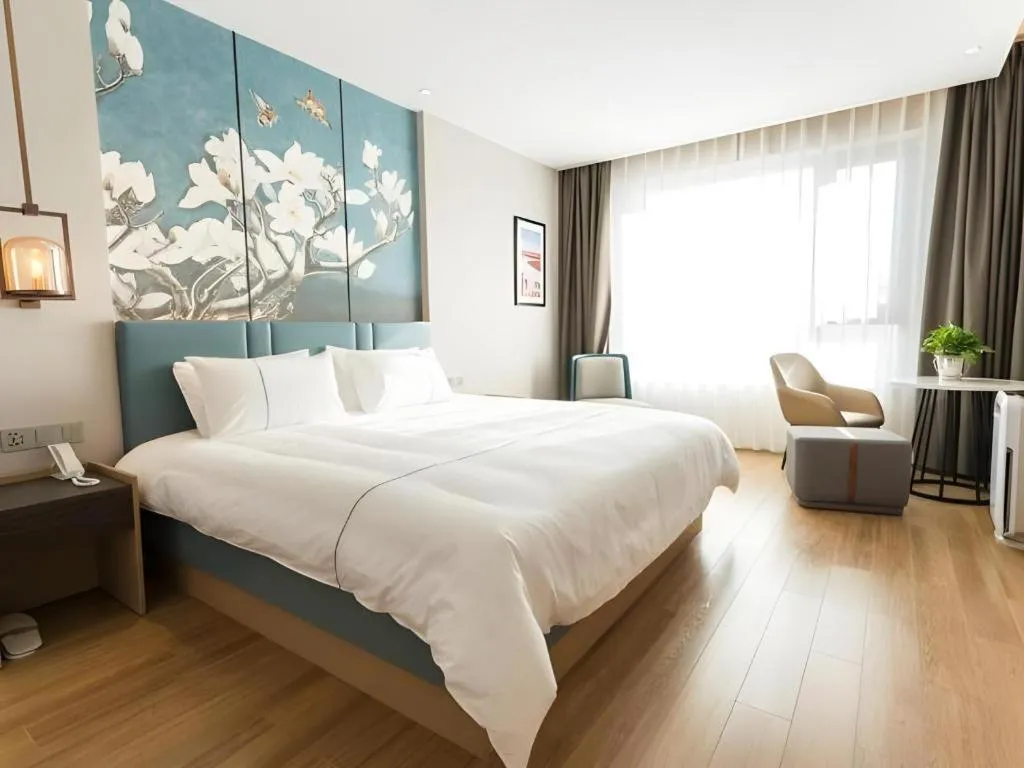 Bed in Magnotel Huludao Xingcheng Central Square Wenquan Street