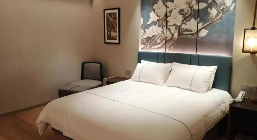 Bed in Magnotel Huludao Xingcheng Central Square Wenquan Street Bed in Magnotel Huludao Xingcheng Central Square Wenquan Street