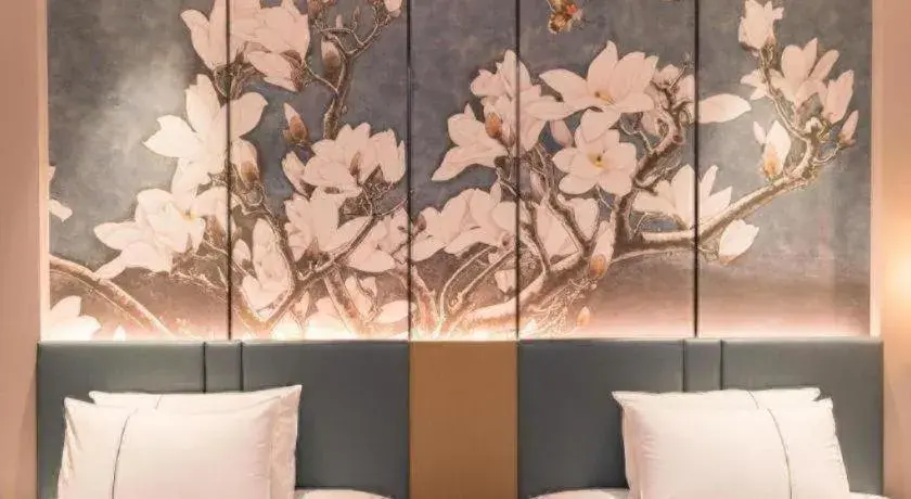 Bed in Magnotel Huludao Xingcheng Central Square Wenquan Street Bed in Magnotel Huludao Xingcheng Central Square Wenquan Street