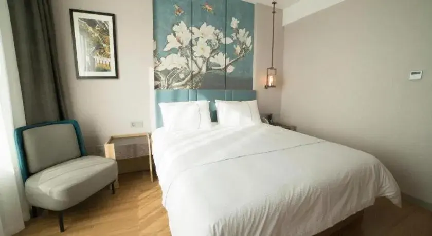 Bed in Magnotel Huludao Xingcheng Central Square Wenquan Street Bed in Magnotel Huludao Xingcheng Central Square Wenquan Street