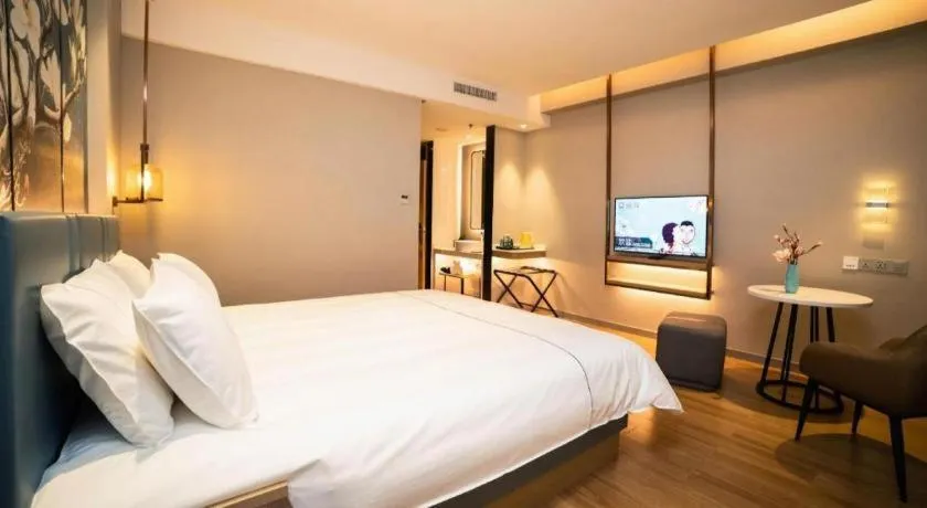 Bed in Magnotel Huludao Xingcheng Central Square Wenquan Street