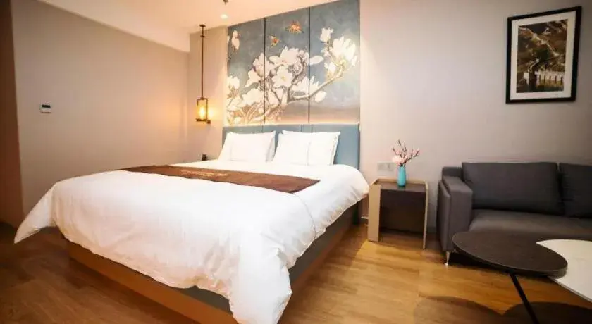 Bed in Magnotel Huludao Xingcheng Central Square Wenquan Street Bed in Magnotel Huludao Xingcheng Central Square Wenquan Street