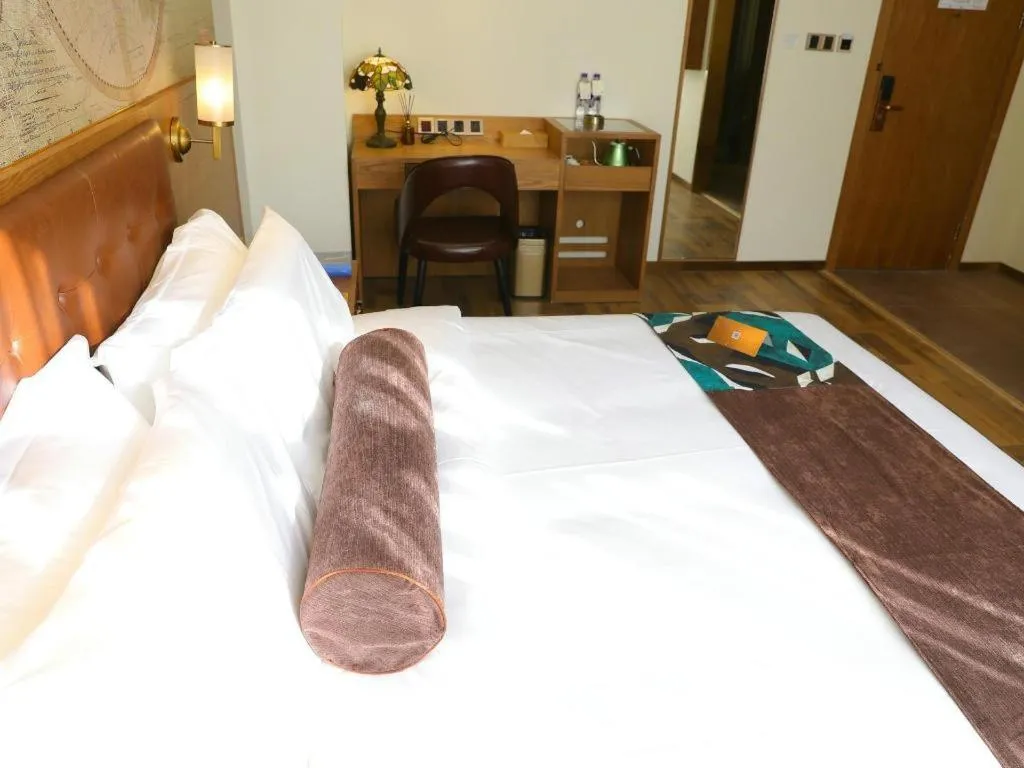 Bed in James Joyce Coffetel Shenyang North Railway Station Qishan Road Metro Station