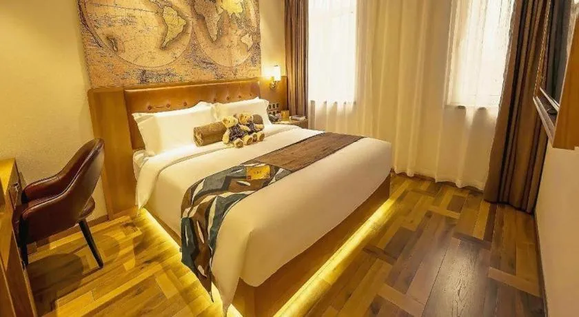 Bed in James Joyce Coffetel Shenyang North Railway Station Qishan Road Metro Station