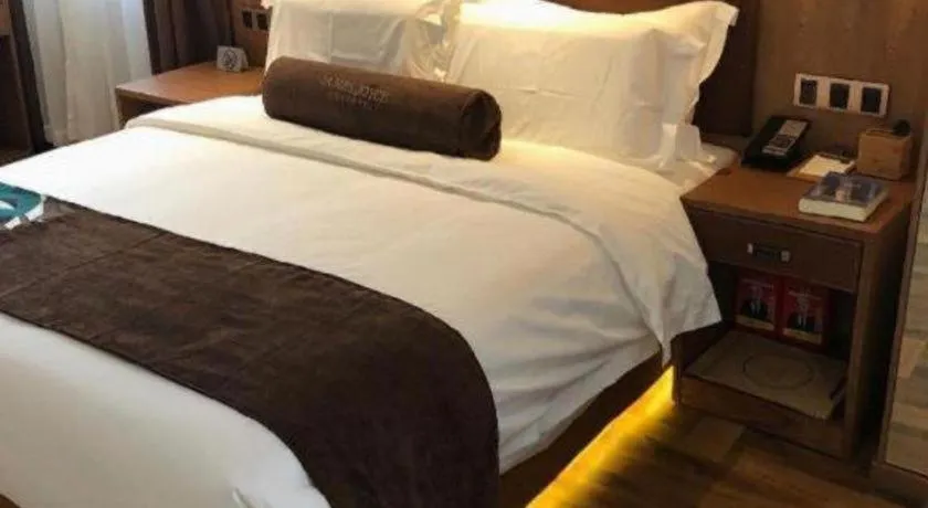 Bed in James Joyce Coffetel Shenyang North Railway Station Qishan Road Metro Station