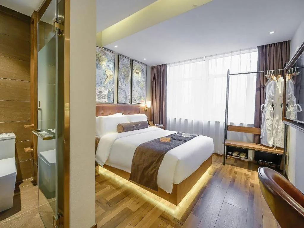 Bed in James Joyce Coffetel Shenyang North Railway Station Qishan Road Metro Station