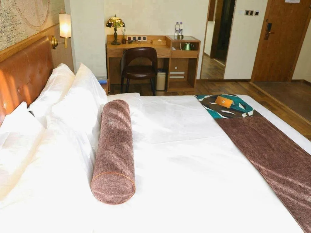 Bed in James Joyce Coffetel Shenyang North Railway Station Qishan Road Metro Station