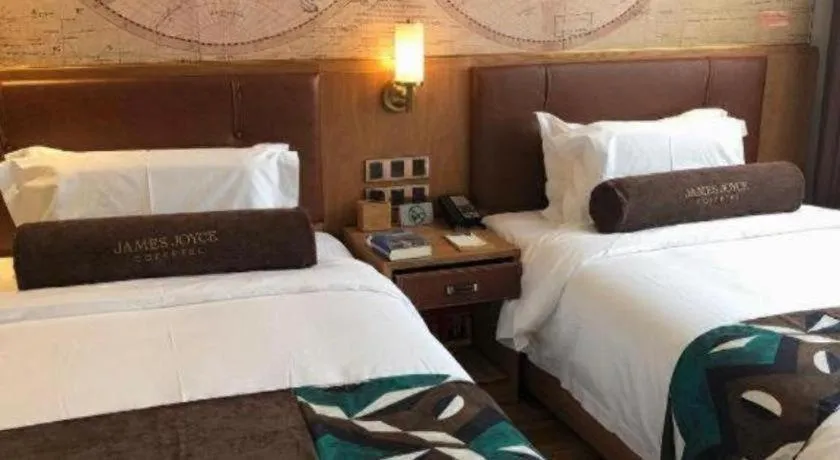 Bed in James Joyce Coffetel Shenyang North Railway Station Qishan Road Metro Station