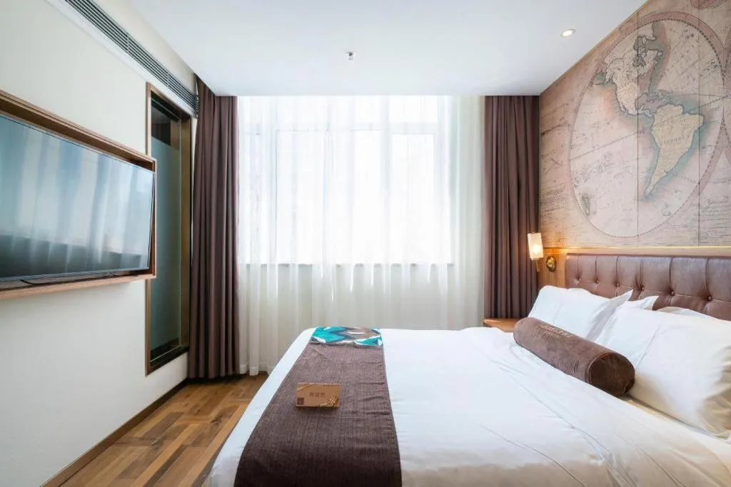 Bed in James Joyce Coffetel Shenyang North Railway Station Qishan Road Metro Station