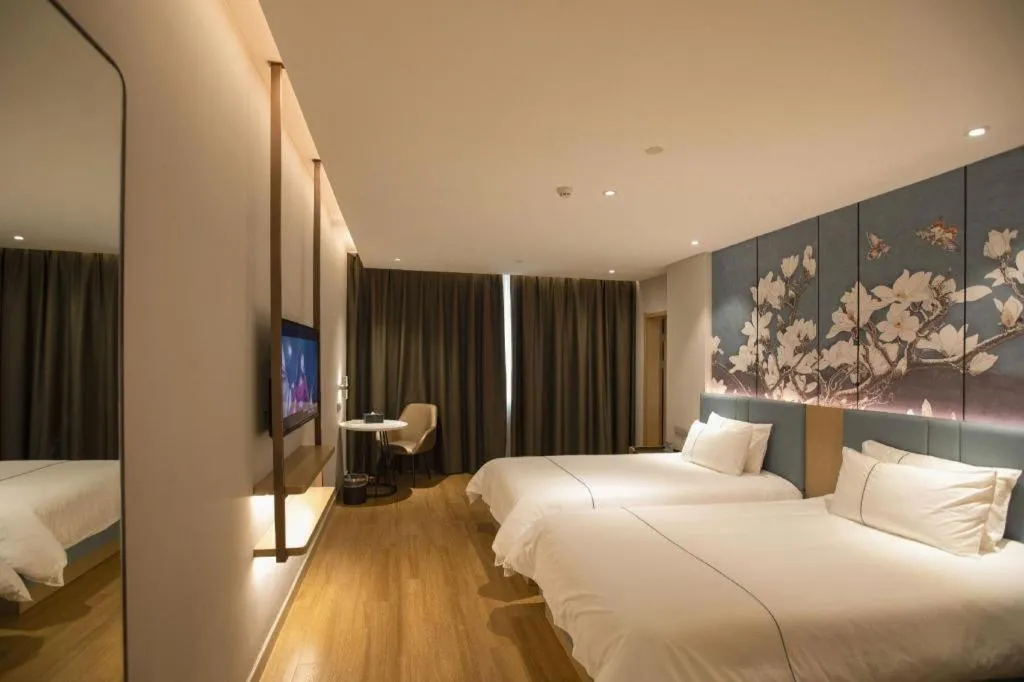 Bed in Magnotel Hotel Dongxing Guomen Port