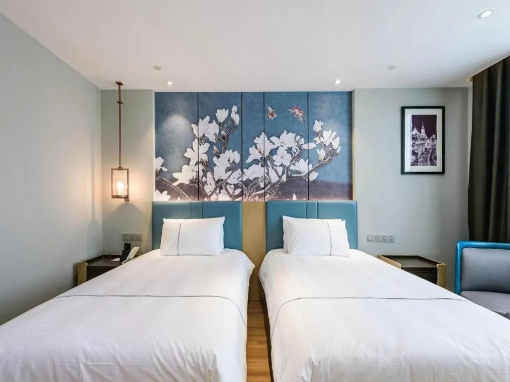 Bed in Magnotel Hotel Dongxing Guomen Port