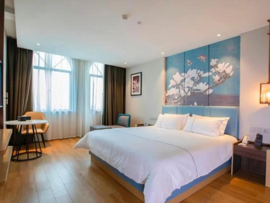 Bed in Magnotel Hotel Dongxing Guomen Port