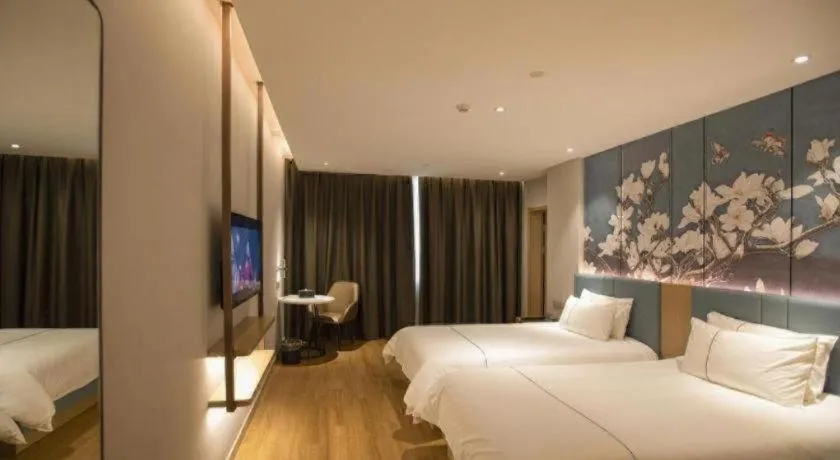 Bed in Magnotel Hotel Dongxing Guomen Port