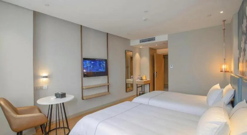 Bed in Magnotel Hotel Dongxing Guomen Port