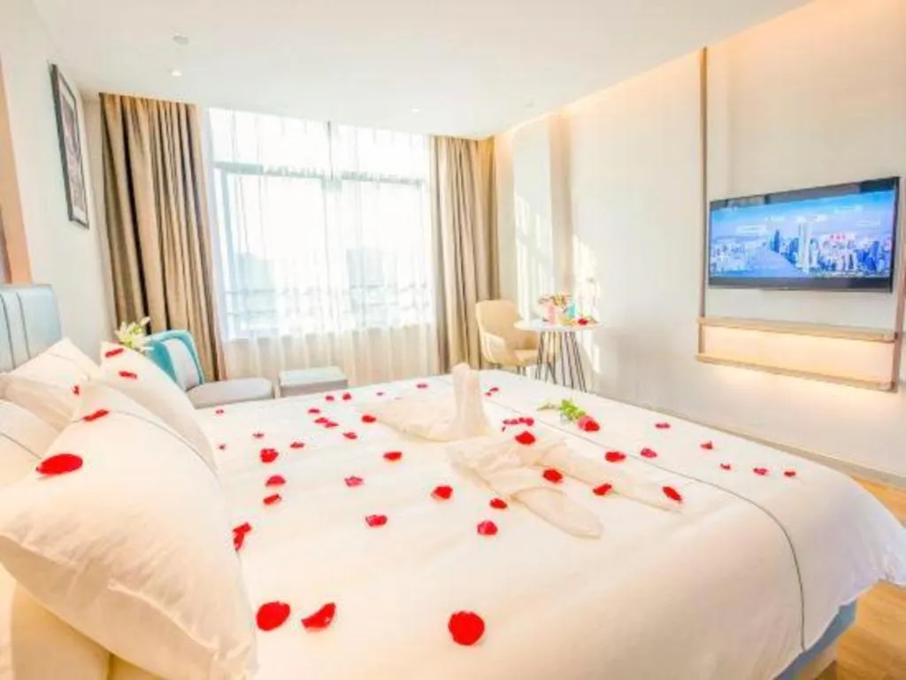Bed in Magnotel Hotel Dongxing Guomen Port