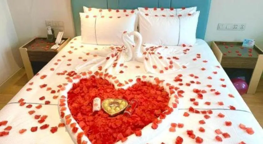 Bed in Magnotel Hotel Dongxing Guomen Port