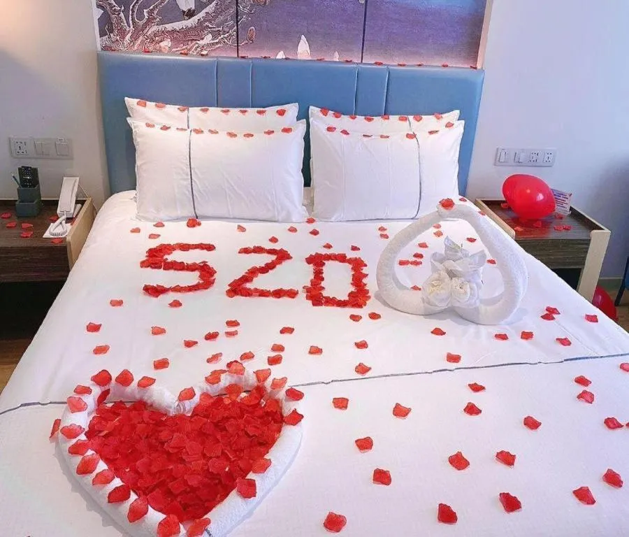 Bed in Magnotel Hotel Dongxing Guomen Port