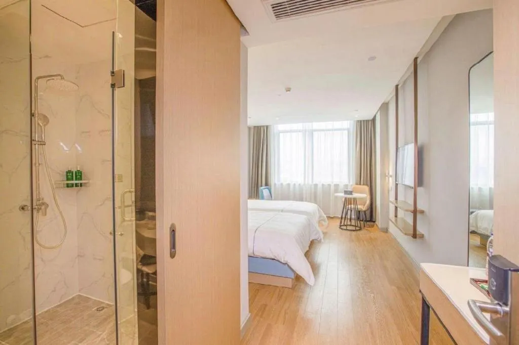 Bed in Magnotel Hotel Dongxing Guomen Port