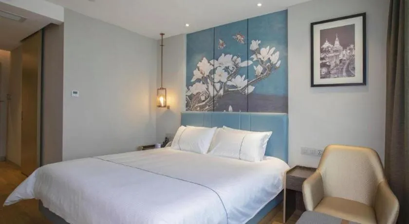 Bed in Magnotel Hotel Dongxing Guomen Port