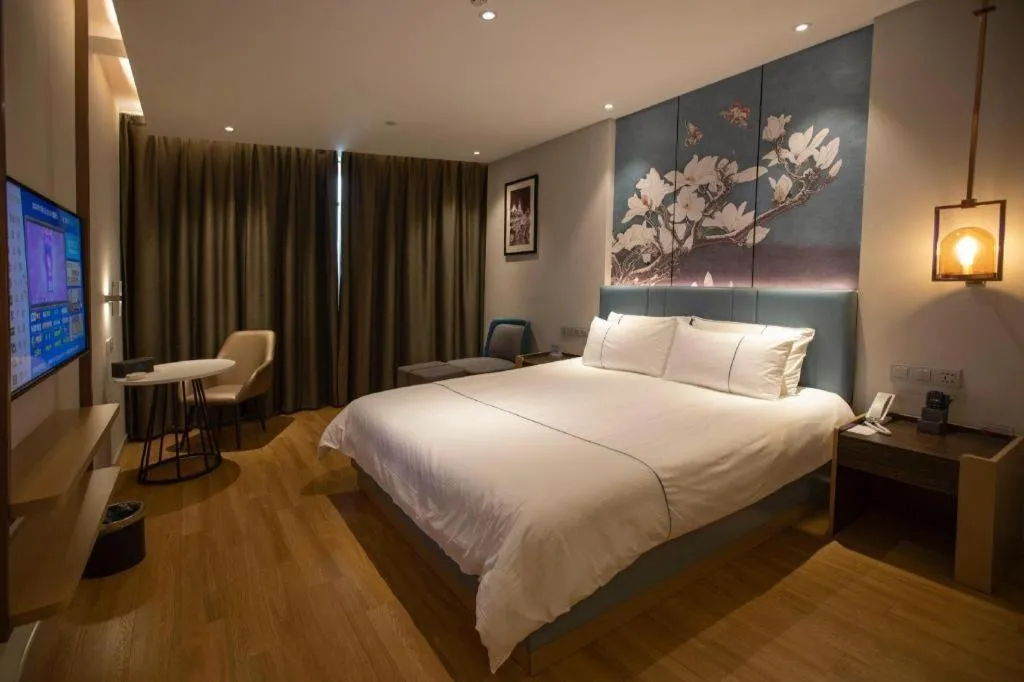 Bed in Magnotel Hotel Dongxing Guomen Port