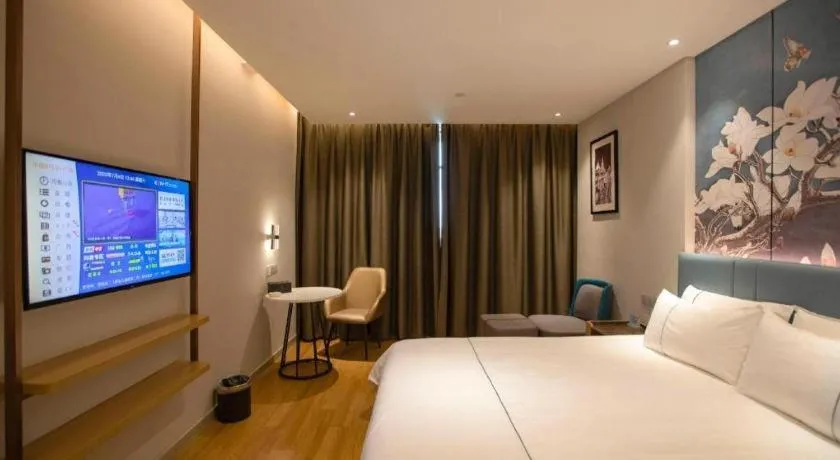 Bed in Magnotel Hotel Dongxing Guomen Port