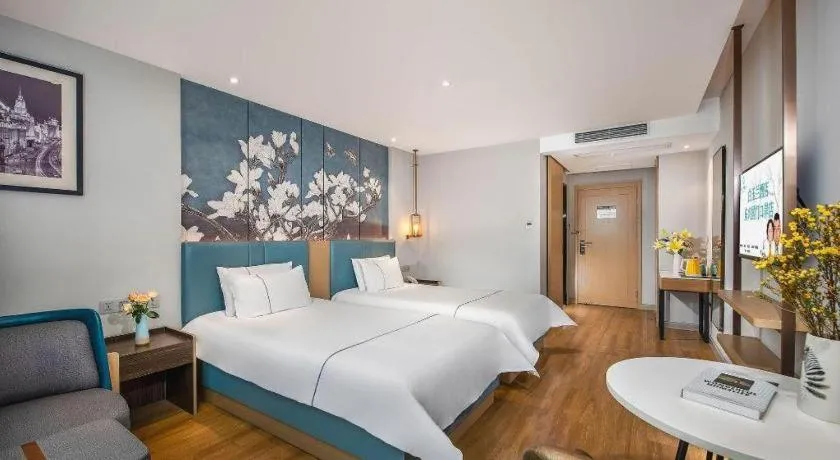 Bed in Magnotel Hotel Dongxing Guomen Port