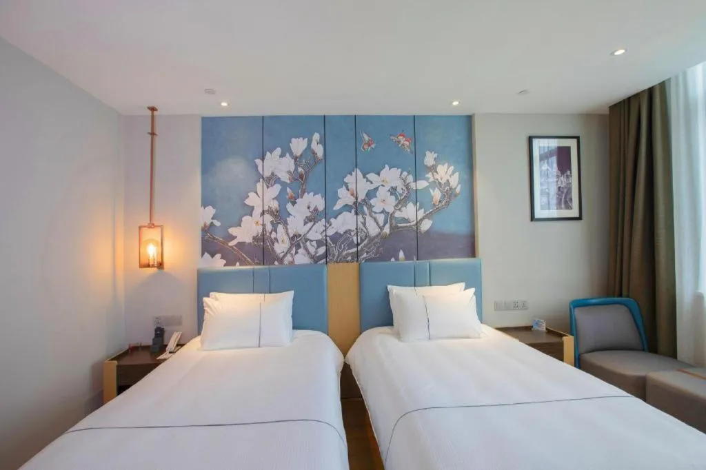 Bed in Magnotel Hotel Dongxing Guomen Port