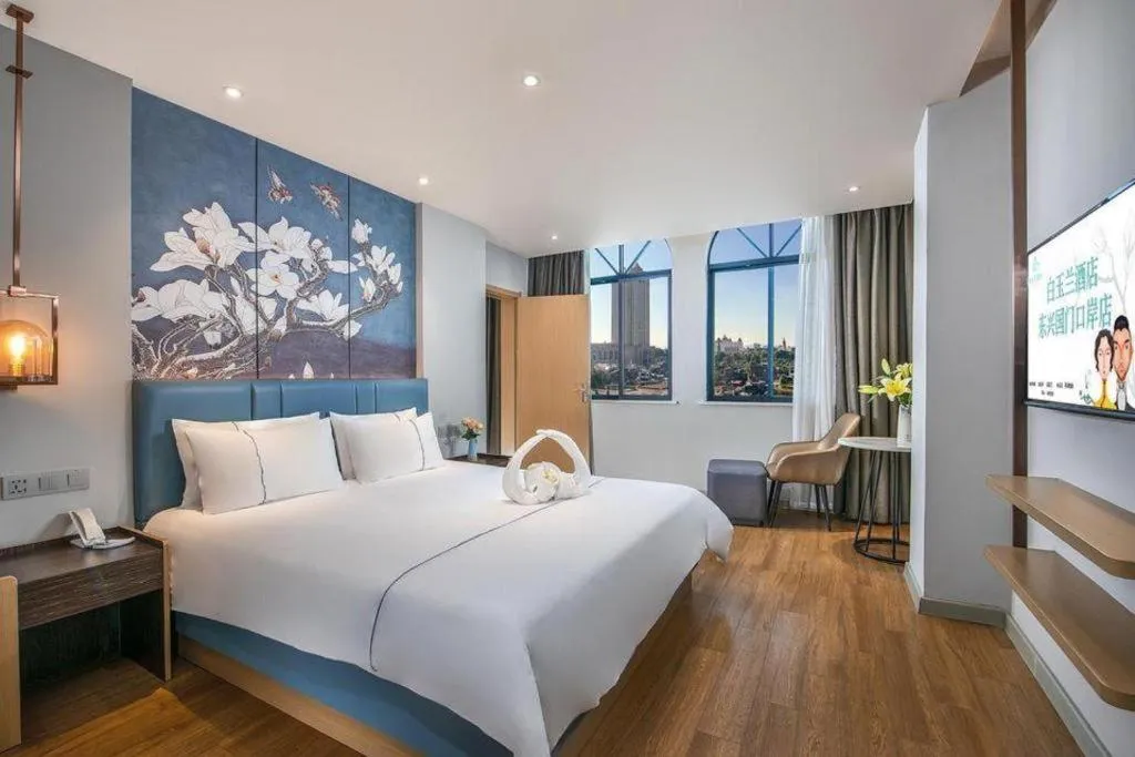 Bed in Magnotel Hotel Dongxing Guomen Port