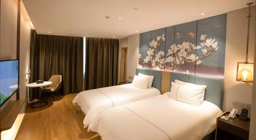 Bed in Magnotel Hotel Dongxing Guomen Port