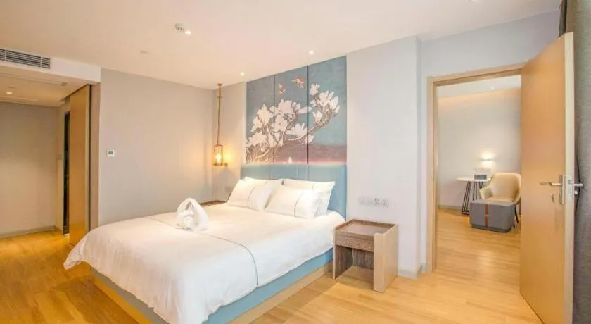 Bed in Magnotel Hotel Dongxing Guomen Port