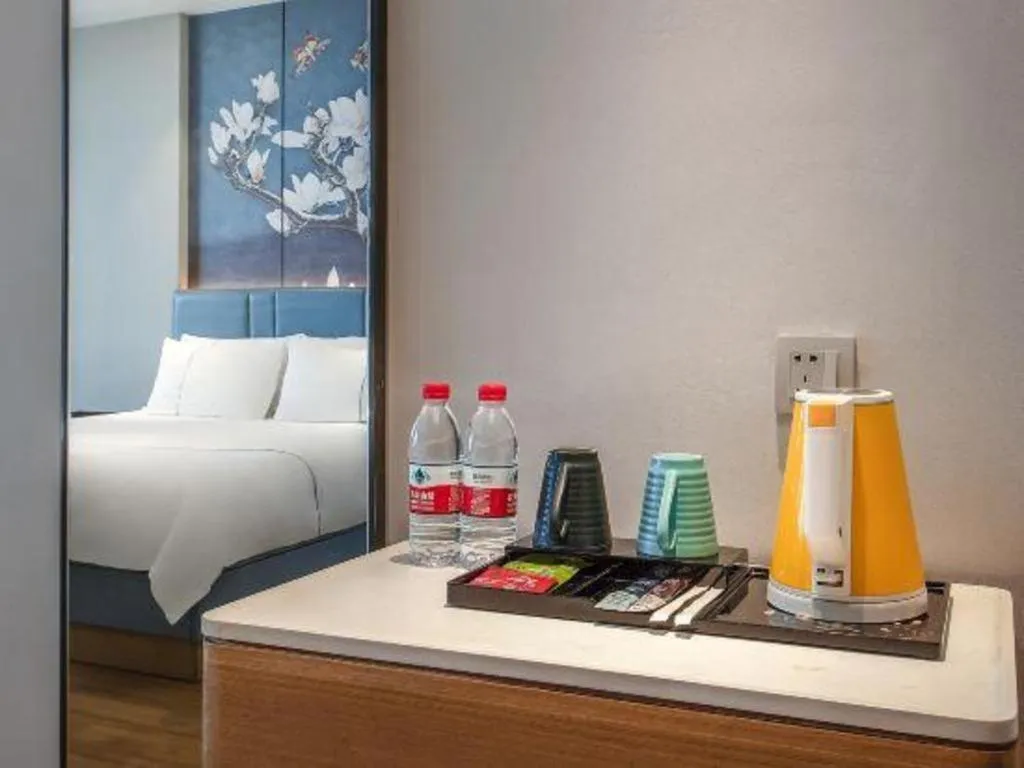 Bed in Magnotel Hotel Dongxing Guomen Port