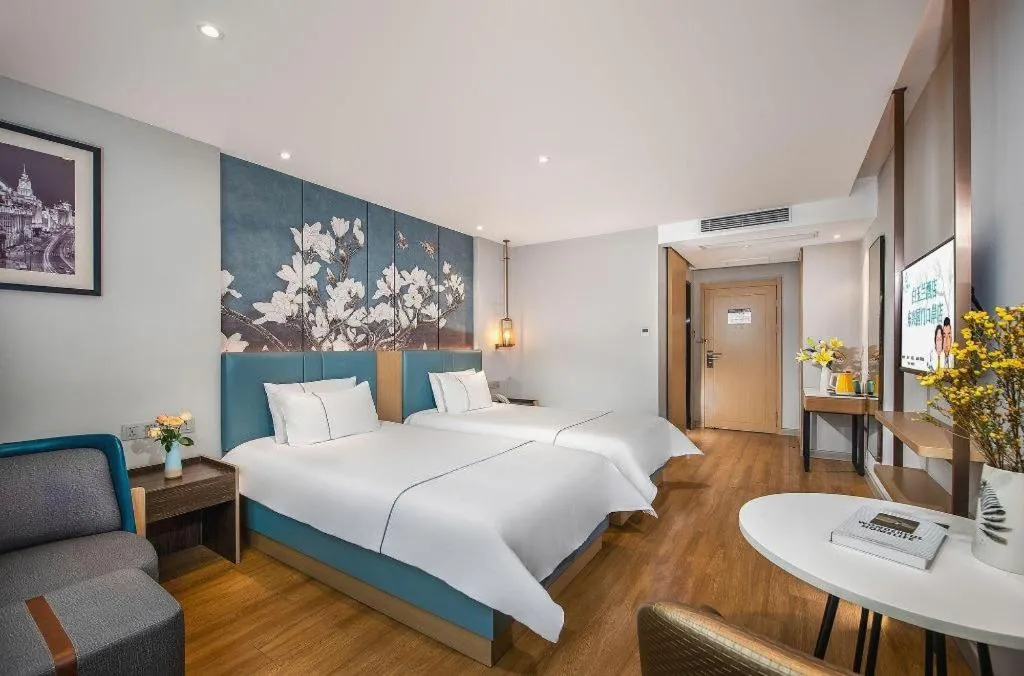 Bed in Magnotel Hotel Dongxing Guomen Port