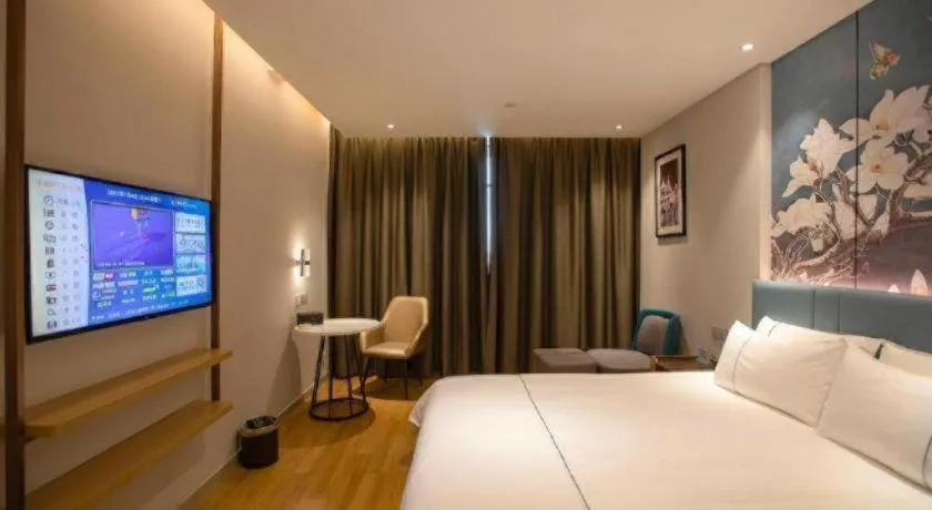 Bed in Magnotel Hotel Dongxing Guomen Port