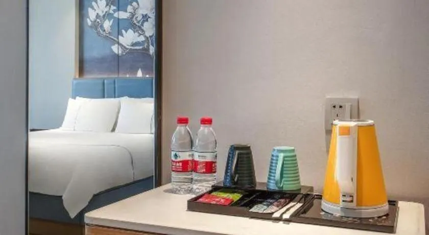 Bed in Magnotel Hotel Dongxing Guomen Port