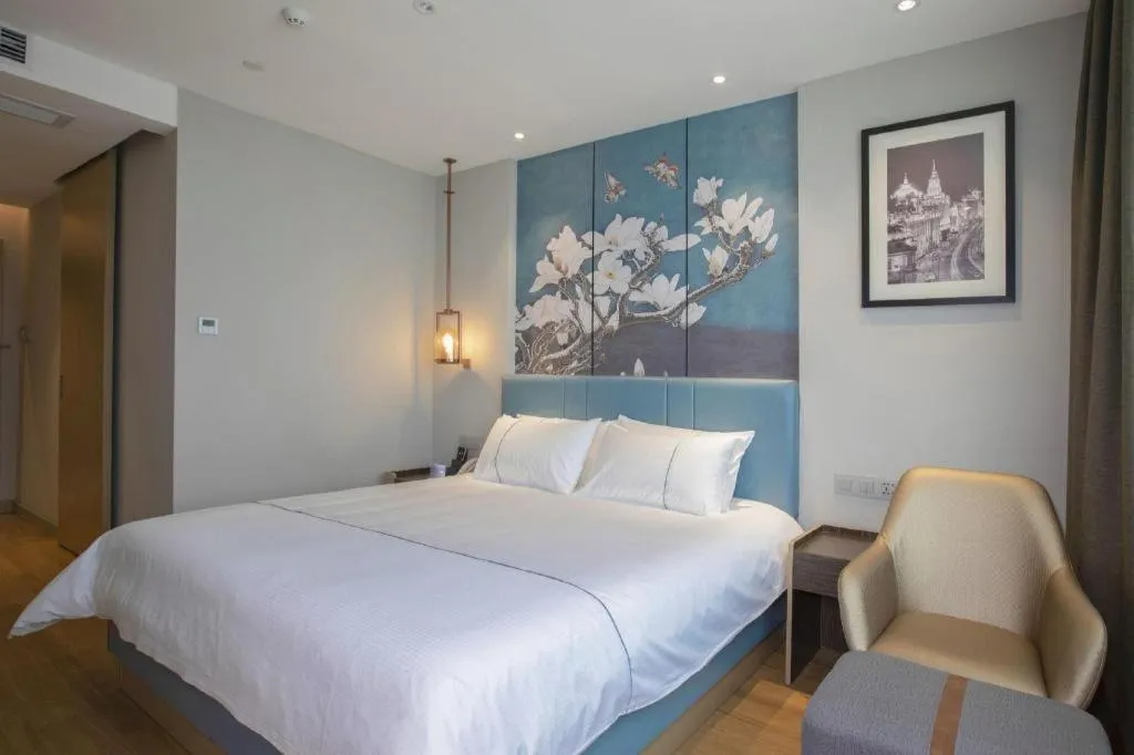 Bed in Magnotel Hotel Dongxing Guomen Port