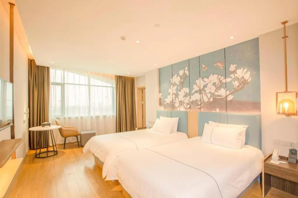 Bed in Magnotel Hotel Dongxing Guomen Port
