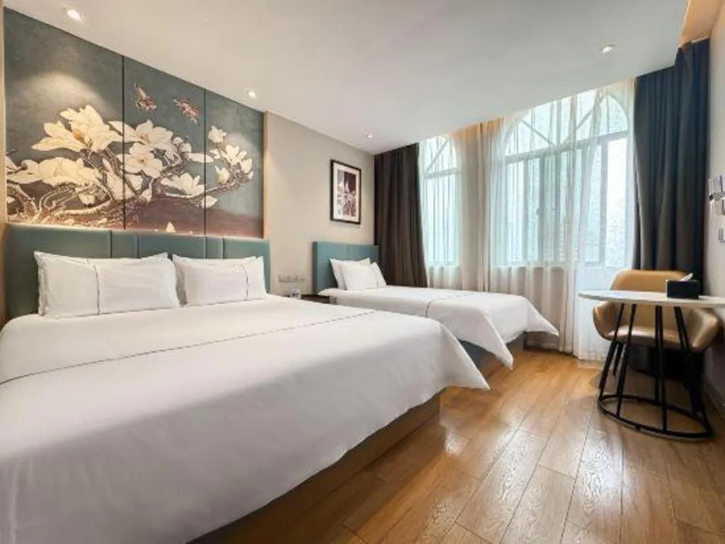 Bed in Magnotel Hotel Dongxing Guomen Port