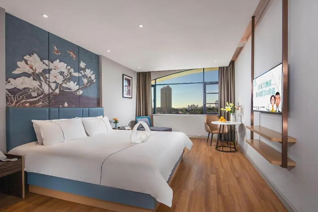 Bed in Magnotel Hotel Dongxing Guomen Port