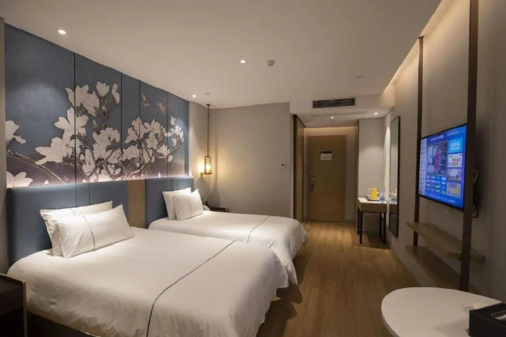 Bed in Magnotel Hotel Dongxing Guomen Port