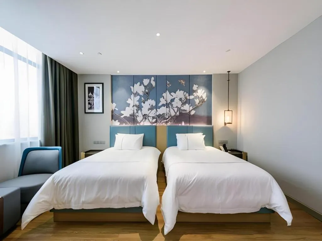 Bed in Magnotel Hotel Dongxing Guomen Port