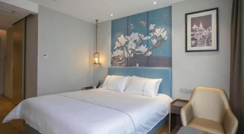 Bed in Magnotel Hotel Dongxing Guomen Port